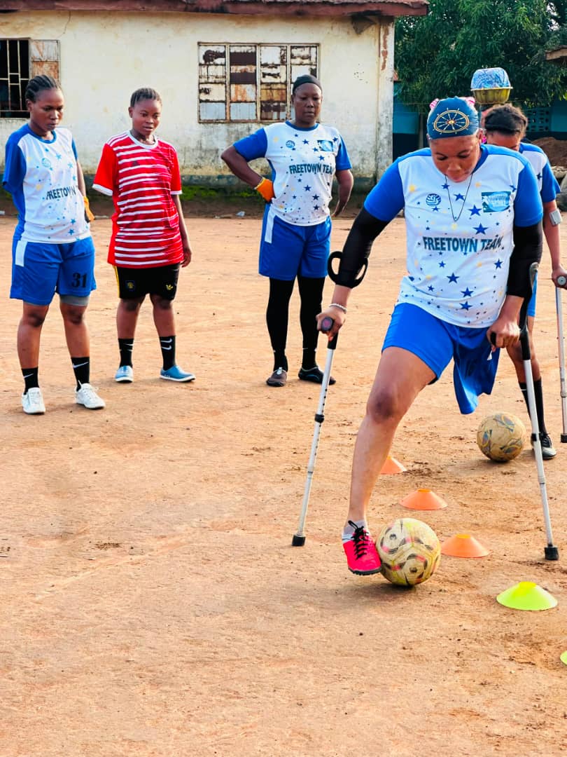 Girl with disability playing football